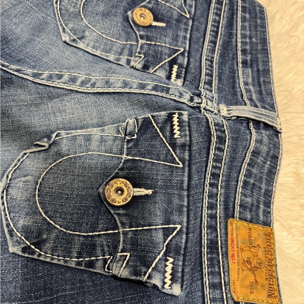 True Religion Blue Jeans with Distinctive Stitching and Quality Denim